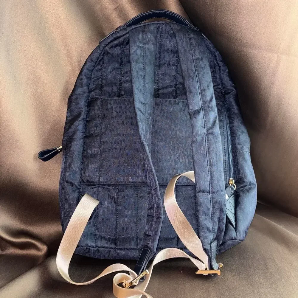 Michael Kors navy Dallas Medium Signature Logo Backpack like new condition
